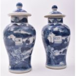 PAIR OF 19TH CENTURY SMALL BLUE AND WHITE LIDDED URNS