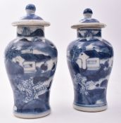 PAIR OF 19TH CENTURY SMALL BLUE AND WHITE LIDDED URNS