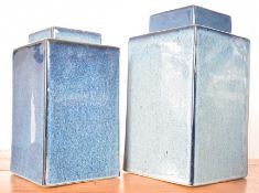 PAIR OF GRADUATING CONTEMPORARY BLUE GLAZED CANISTERS