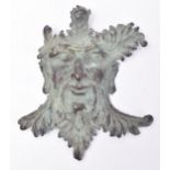 LATE 19TH CENTURY CAST BRONZE WALL MOUNTED GREEN MAN PLAQUE