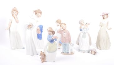 COLLECTION OF NINE PORCELAIN NAO FIGURES BY LLADRO