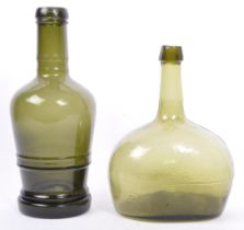 TWO EARLY TO MID 20TH CENTURY LARGE GREEN GLASS BOTTLES