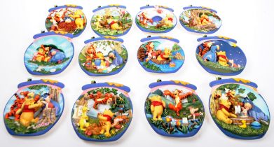 TWELVE COLLECTOR WINNIE THE POOH CABINET / WALL PLATES