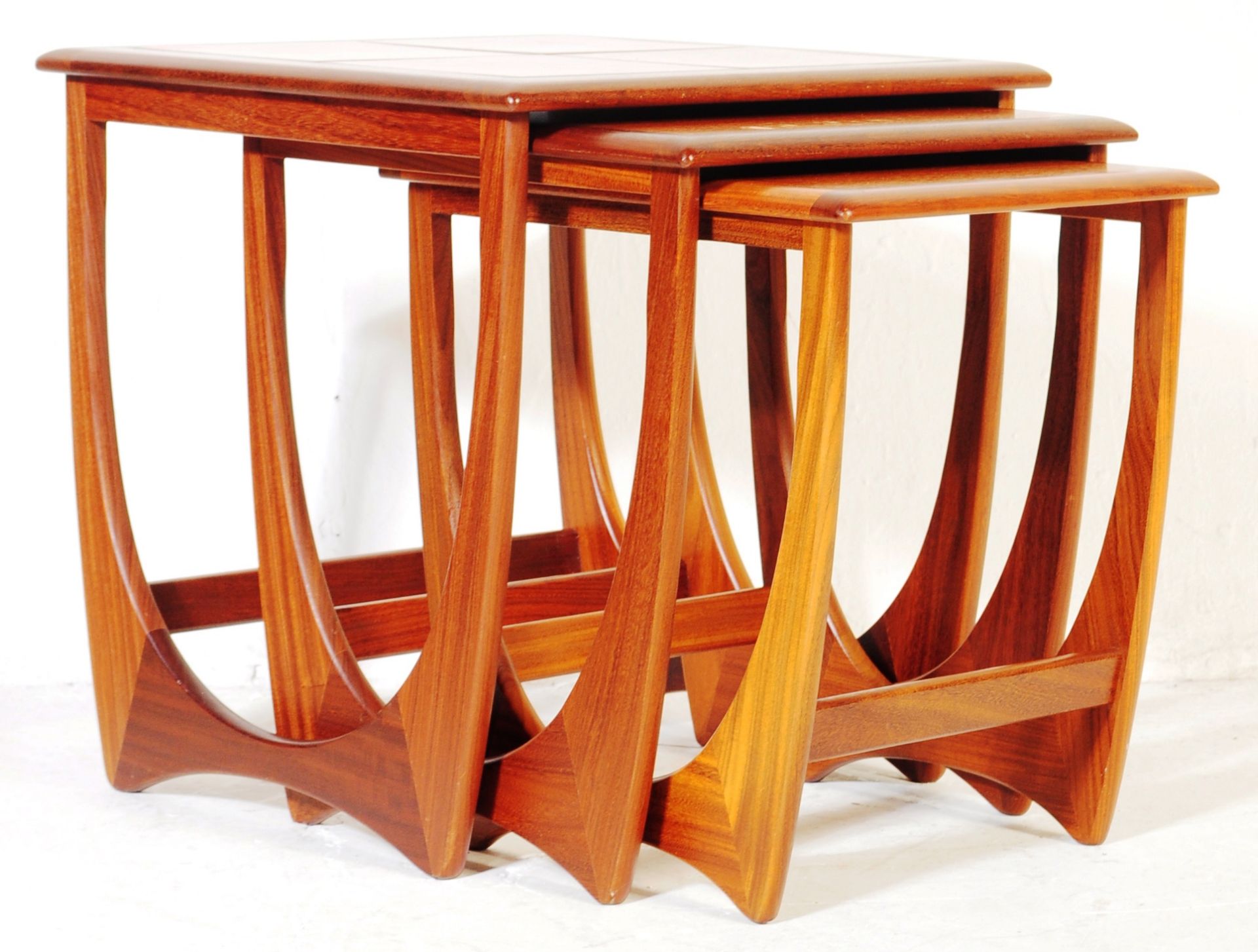 A 1970'S G-PLAN FURNITURE ASTRO TEAK WOOD NEST OF TABLES.
