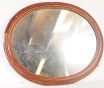 EARLY 20TH CENTURY OAK OVAL OVER MANTEL MIRROR