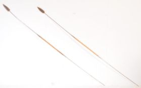 PAIR OF 20TH CENTURY STAINLESS STEEL AND WOOD THROWING SPEARS