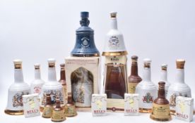 FOURTEEN BELL'S WHISKY COMMEMORATIVE BELL DECANTERS