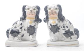 PAIR OF 19TH CENTURY STAFFORDSHIRE PORCELAIN MANTLE DOGS