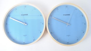 PAIR OF LATE 20TH CENTURY 1990S WALL CLOCKS IN BABY BLUE