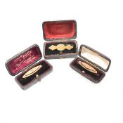 THREE ANTIQUE GOLD PLATED & BOXED BROOCH PINS
