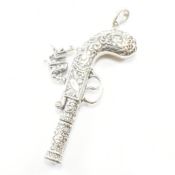 WHITE METAL WHISTLE PENDANT IN THE FORM OF A PISTOL