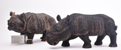 PAIR OF CONTEMPORARY RHINO CARVED SCULPTURES