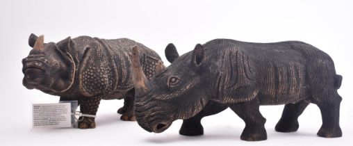 PAIR OF CONTEMPORARY RHINO CARVED SCULPTURES