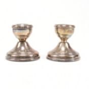 PAIR OF CONTEMPORARY HALLMARKED SILVER SQUAT CANDLESTICKS.
