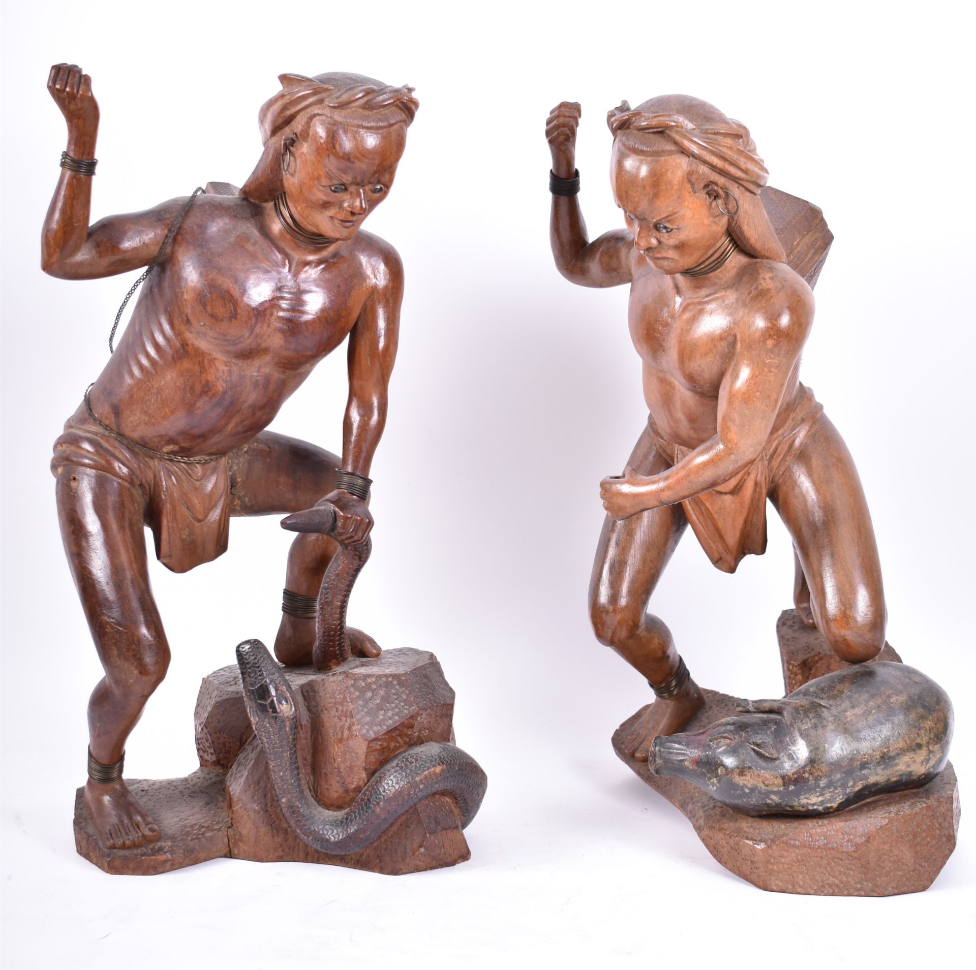 PAIR OF EARLY 20TH CENTURY ORIENTAL CARVED WOOD HUNTERS