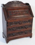 19TH CENTURY CARVED MAHOGANY JACOBEAN REVIVAL BUREAU