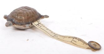 EARLY 20TH CENTURY COLD PAINTED METAL TURTLE TAPE MEASURE
