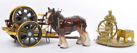 A VINTAGE BRASS BLACKSMITHS DISPLAY WITH CERAMIC HORSE & CART