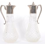 PAIR OF EARLY 20TH CENTURY SILVER PLATED GLASS CLARET JUGS