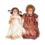 TWO EARLY 20TH CENTURY BISQUE HEADED DOLLS