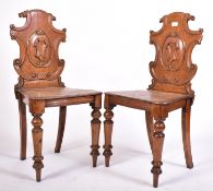 PAIR OF VICTORIAN 19TH CENTURY ARMORIAL OAK HALL CHAIRS