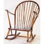 MID 20TH CENTURY DARK ELM STICK BACK ROCKING ARMCHAIR