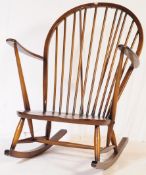 MID 20TH CENTURY DARK ELM STICK BACK ROCKING ARMCHAIR