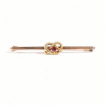 1920S 9CT GOLD & RUBY KNOT BROOCH PIN