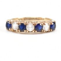 HALLMARKED 9CT GOLD SYNTHETIC SAPPHIRE & SPINEL SEVEN STONE