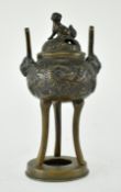 BRONZE TRIPOD CENSER WITH DRAGON WITH FOO DOG FINIAL
