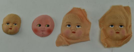 MID 20TH CENTURY CLOTH MOULDED DOLL FACES