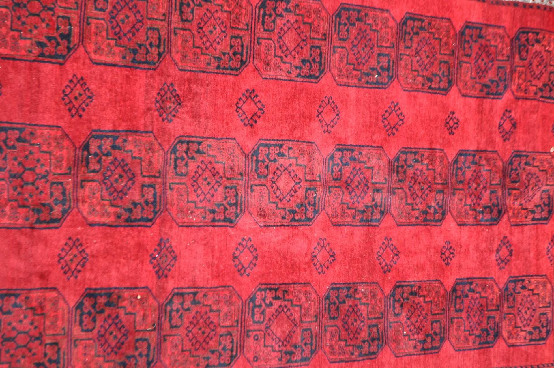 20TH CENTURY AFGHAN ART DECO RED RUG - Image 2 of 4