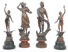 FOUR 20TH CENTURY PAINTED SPELTER FIGURES