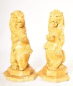 20TH CENTURY MATCHING PAIR OF POTTERY GARDEN LION FIGURES