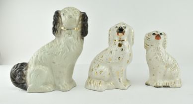 THREE EARLY 20TH CENTURY STAFFORDSHIRE CHINA SPANIEL DOGS