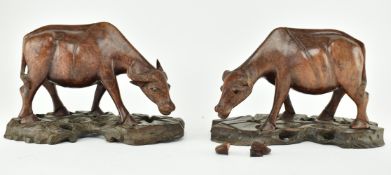 PAIR OF CHINESE CARVED WOODEN OX ON PLINTHS