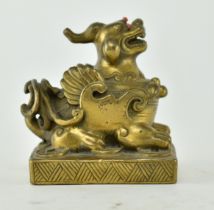 CHINESE BRASS MYTHICAL ANIMAL WITH GEMSTONE EYES