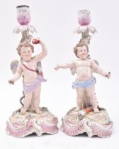 PAIR OF 19TH CENTURY SITZENDORF PORCELAIN PUTTI CANDLESTICKS