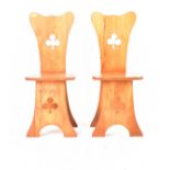 MATCHING PAIR OF CARVED PINE CLOVER CHAIRS