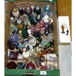 A collection of approximately 70 various coloured glass scent bottles and atomisers.