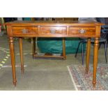 A modern mahogany Edwardian-style side table, the rectangular top above three drawers, on turned