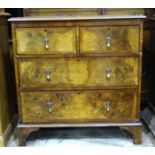 A walnut chest of two short and two long cross-banded drawers, on bracket feet, 81cm wide, 85cm