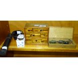 A set of brass and steel travelling scales and weights in case, a miniature wooden jewellery chest