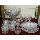 A large modern cut-glass punch bowl decorated with flowers and bees, on glass stand, 35cm