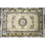 An NTC Oriental Carpets modern silk-lined rug in cream and olive-green colourway, with exotic birds