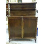 A mahogany chiffonier, the two-tiered back supported by brassed columns, above a pair of cupboard