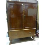 A mahogany two-door linen press on later drawer and feet, 128cm wide, 180cm high.