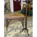 An early-20th century oak campaign writing table with hinged folding legs, fitted with a drawer