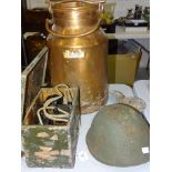 A 1970's military steel helmet with MOD mark, a Bren Mk1 machine gun magazine, brass shell cases,