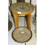 A 20th century Aboriginal wood tree trunk four-legged stool, the concave seat profusely-inlaid